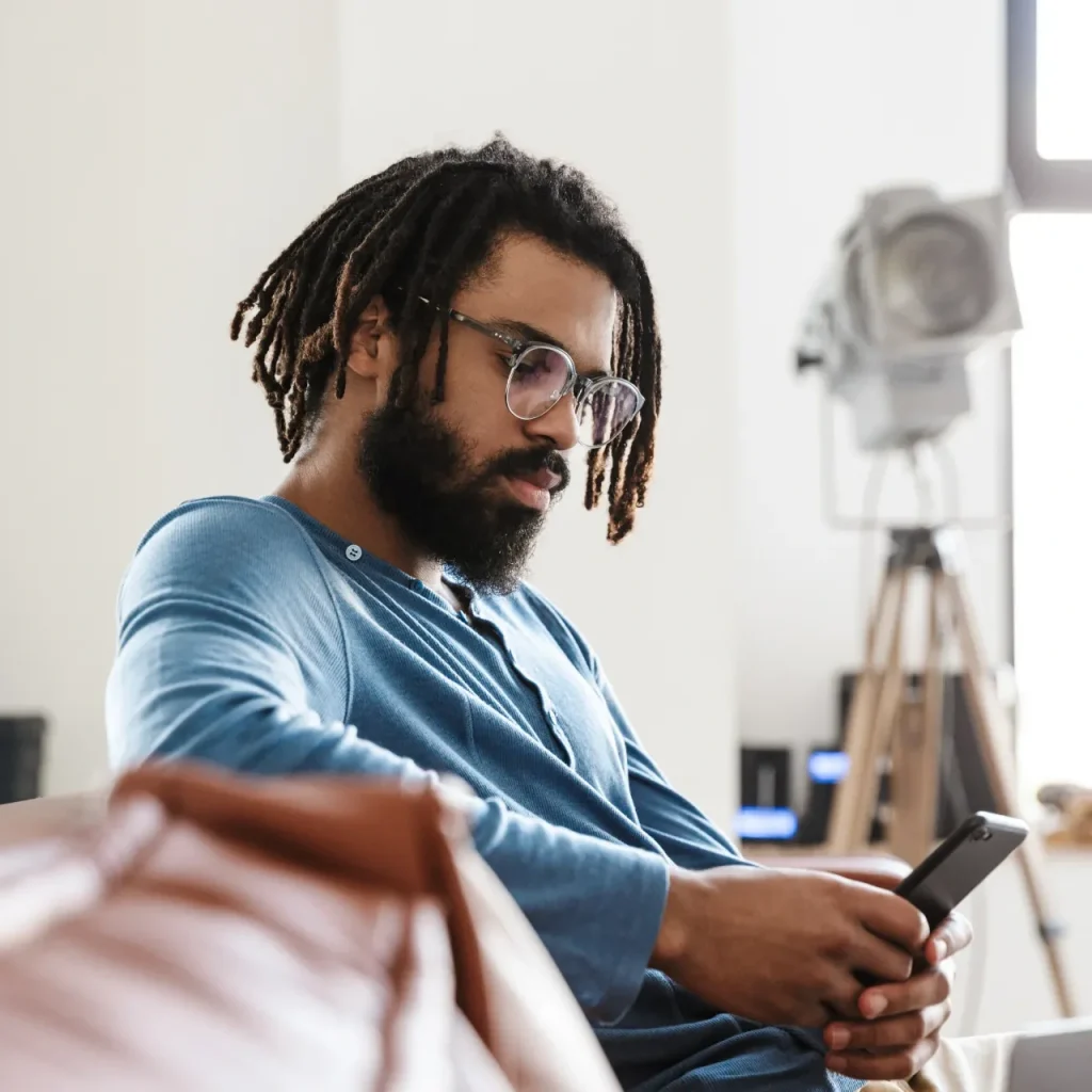Man on his phone - self help link